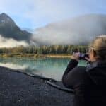 Guest taking some memories home with them on the Glaciers, Trails & Tides Tour - the Explorer Glacier photo stop provides a chance to see salmon in the fall
