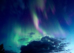 A photo of the Aurora Borealis at night in Alaska taken by Salmon Berry Travel Tours